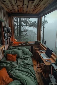 a bed sitting in a bedroom next to a window filled with lots of green furniture