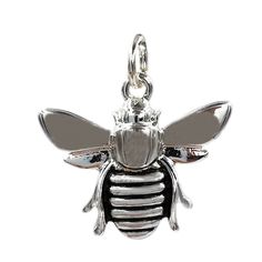 a silver and black bee charm on a white background