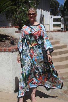 Beautiful tropical print designer silk kaftan for your summer enjoyment.  Casual or dressy you will enjoy this beauty for any occasion. One size.  Fits small to extra large sizes.  The width is 51 inches, edge to edge, 102 around the body.  The side seams are 6 inches from the edge.  The length is 50 inches.  Hand or machine wash on a short, gentle cycle. Silk Caftan, Beach Caftan, Dresses Silk, Long Kaftan, Silk Kaftan, Silk Dress Long, Long Dresses, Tropical Print, Dress Long