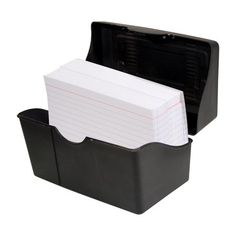 a black plastic box with two dividers and notepads in the bottom compartment