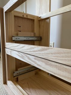 a wooden shelf with some drawers underneath it