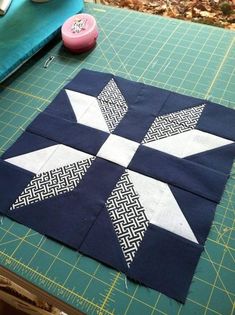 the block is made up of blocks with white and black designs on them, along with some scissors