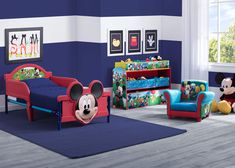 a mickey mouse bedroom with blue walls and red bedding, colorful furniture and accessories