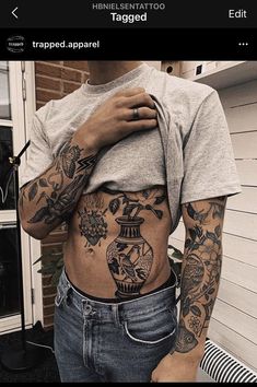 a person with tattoos on their stomach