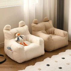 two children's chairs with stuffed animals on them in front of a window and rug