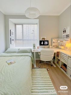 a bedroom with two beds and a desk