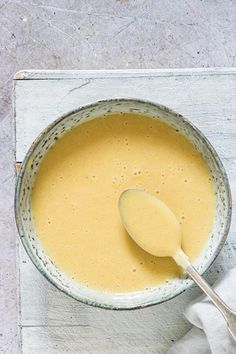 a bowl of soup with a spoon in it