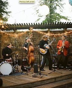 a group of people that are playing on some kind of stage