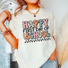 Get ready for the new school year with our "First Day Of School Teacher Shirt." This retro-inspired tee, designed in vibrant colors and a playful font, captures the excitement of starting afresh. Made with Comfort Colors for ultimate comfort, this shirt is perfect for all teachers. Grab yours today and rock the retro vibes on your first day back in style! **This design features a cool retro distressed look** Comfort Colors introduces its garment-dyed t-shirt; a fully customizable tee made 100% w School Spirit T-shirt For College And Back To School, Back To School Spirit T-shirt For College, School Spirit Screen Print Tops, School Spirit Tops With Screen Print, Multicolor Letter Print T-shirt For School Events, Screen Print Tops For College, Back To School Spirit Shirt With Text Print, College Style Graphic T-shirt For School, Collegiate Graphic Print Tops For School