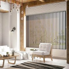 a living room with white furniture and wooden blinds