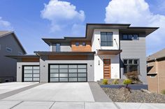 a two story house with lots of windows