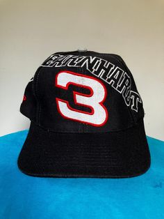 True vintage Dale Earnhardt stretched name spellout snapback hat from the 90's by Sports Image. Black cap with embroidered logos, excellent shape, OSFA. Vintage Snapback Hat With Curved Bill For Sports, Throwback Baseball Cap For Streetwear, Vintage Sports Hat With Letter Print, 90s Style Baseball Cap For Streetwear, Vintage Black Snapback Hat For Sports, Vintage Black Trucker Hat For Sports, 90s Streetwear Baseball Cap With Curved Brim, 90s Style Curved Brim Baseball Cap For Streetwear, 90s Style Adjustable Baseball Cap Snapback Hat