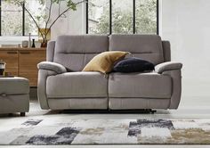 a living room scene with focus on the reclining sofa