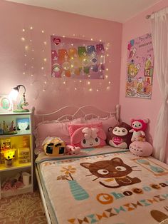 a child's bedroom decorated in pink and brown with teddy bears on the bed