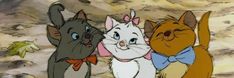 three cartoon cats standing next to each other in front of a rock face with one cat wearing a bow tie