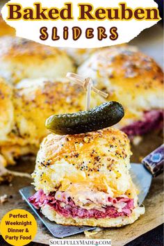 baked reuben sliders with pickle on top and text overlay that reads baked reuben sliders