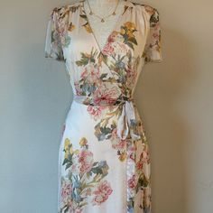 Floral Wrap Maxi Dress. Perfect For Spring & Outdoor Occasions! Offers Short Sleeves And Tie Empire Waist. Nwt Sizing: S= 2/4 M= 6/8 L= 10/12 Color: Multi ( Cream, Rose, Blue, Yellow) Fit: True To Size. Fabric: 100% Rayon Hand Wash/Delicate Cycle W/ Cold Water, Hang To Dry! Any Questions, Feel Free To Ask! Cream Short Sleeve Dresses With Floral Print, Cream Floral Print Dresses With Short Sleeves, Fitted Cream Floral Dress For Spring, Feminine Cream Floral Dress For Summer, Fitted Cream Floral Dress For Summer, Cream Short Sleeve Maxi Dress For Garden Party, Cream Short Sleeve Maxi Dress For Spring, Cream Short Sleeve Floral Dress For Garden Party, Cream Floral Short Sleeve Dress For Garden Party