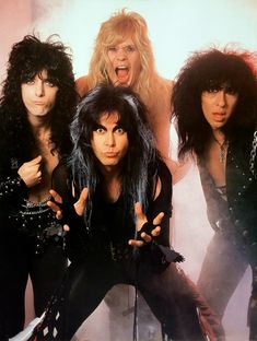 the band kiss posing in front of a white background