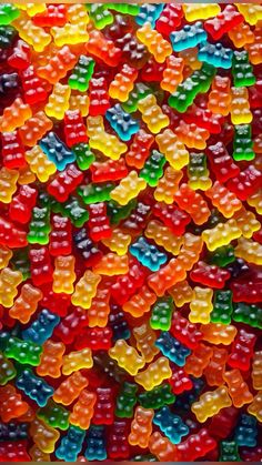 many different colored gummy bears are in the image and it looks like they have been made