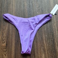 Nessy Swimwear Purple Bikini Bottoms Stretch Solid Color Swimwear For Beach, Solid Color Beachwear Swimwear For Beach Season, Solid Color Beachwear For Poolside, Fitted Solid Color Swimwear For Vacation, Fitted Solid Color Beach Bottoms, Fitted Solid Color Bottoms For Beach, Purple Brief Swimwear For Summer, Fitted Solid Color Swimwear For Poolside, Fitted Solid Color Swimwear For Beachwear