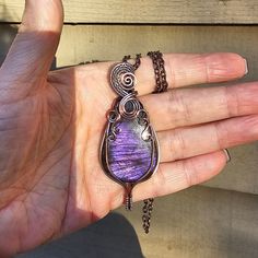 **You will receive the exact same pendant as shown in these pictures. All of my pieces are handmade by me with love and kindness.** This is a gorgeous, natural purple Labradorite that I wrapped up snug in solid copper wire. I antiqued the copper to bring out the texture and pattern of the wire work and I just love the result! This beauty measures 2 - 7/8 of an inch long by 1 - 1/8 of an inch wide and it will come on an adjustable leather or vegan cotton cord, or you can choose a matching copper Unique Hand Forged Purple Necklaces, Handmade Purple Copper Jewelry, Artisan Purple Hand Wrapped Jewelry, Artisan Hand Wrapped Purple Jewelry, Purple Artisan Hand-wrapped Jewelry, Hand Wrapped Purple Copper Jewelry, Unique Purple Copper Necklace, Bohemian Purple Hand Forged Necklace, Handmade Purple Copper Wire Necklace