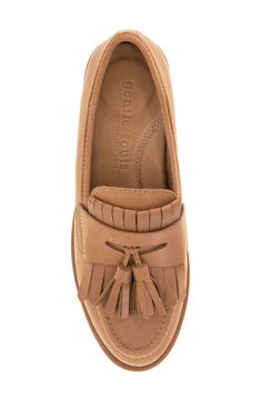 Decorative tassels and kiltie fringe enrich the instep of a sophisticated penny loafer grounded by a cushioned insole for optimal comfort. Memory foam cushioning Removable, PORON®-cushioned insole with arch support Leather or genuine-calf-hair upper/leather lining/rubber sole Imported Leather Tassel Loafers With Fringe For Work, Classic Leather Tassel Loafers With Fringe, Classic Semi-formal Tassel Loafers With Leather Sole, Timeless Semi-formal Tassel Loafers With Leather Lining, Brown Tassel Loafers With Leather Sole For Semi-formal, Semi-formal Tassel Loafers With Rubber Sole And Calf Leather, Semi-formal Brown Tassel Loafers With Rubber Sole, Decorative Tassels, Penny Loafer