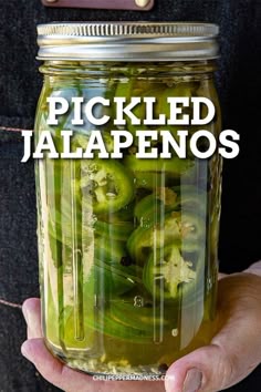 pickled jalapenos in a mason jar with text overlay that reads pickled jalapenos