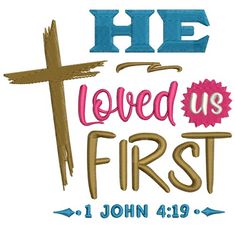 the words he loved us first are shown in blue, pink and gold with a cross