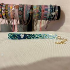 several bracelets are sitting on a table