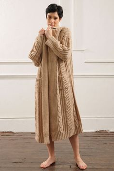 The Kendall Long Cable Knit Cardigan embodies effortless style and warmth. Its flowing silhouette and rich cable design offer a chic, timeless look, perfect for layering. Crafted from 100% Baby Alpaca, this cardigan promises a soft, luxurious feel that will keep you cozy without sacrificing elegance. A versatile addition to any wardrobe. Exceptionally soft and warm Elegant, long silhouette that drapes beautifully Features a classic cable-knit design Comes in four natural, neutral tones Perfect f Long Cable Knit Cardigan, Poncho Tops, Cable Knit Cardigan, Mens Pajamas, Baby Alpaca, Sweater Coats, British Indian, Neutral Tones, Blouse Dress