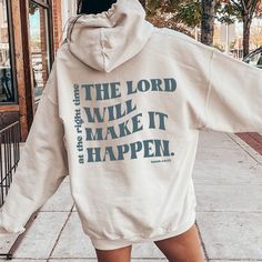 Experience the power of faith with The Lord will Make it Happen Hoodie. This impeccably designed hoodie features the inspiring message, reminding you that with faith, anything is possible. Made with high-quality materials, this hoodie is the perfect addition to your wardrobe for a daily reminder of the strength of your faith. Printed in a Grey-Blue ink color. Design is Printed Direct to Garment printed on back of Hoodie, front is blank See Size Guide for Unisex Hoodie in photos We recommend comparing these measurements against a sweatshirt that you like the fit of for ordering a sweatshirt that will fit best. Crafted Just for You: Our products are made to order, and we're all about delivering that extra touch of personalization. Expect an order confirmation email right after you shop, and Back Of Hoodie, Hoodie For Women, Anything Is Possible, Selling Clothes