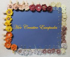 there are many flowers and pins on the blue board with words here creative escapes written in it