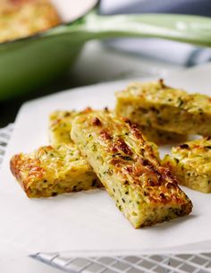 four pieces of food on a plate with the words food bake love written above it