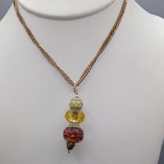 "Vintage Hand Beaded Crystal and Art Glass Drop Pendant on Gold Tone Chain Necklace, Smoky Brown and Gold Tones, Lots of Sparkle 20\" necklace; 2\" x 1/2\" pendant Condition * Very Nice Condition. Gently used. Size: Womens 20\" Condition: Pre-Owned Good" Multi-strand Beaded Chain Necklace Gift, Adjustable Chain Necklace With Colorful Round Beads, Multi-strand Glass Beaded Chain Necklaces, Multi-strand Glass Necklace For Gifts, Adjustable Glass Beaded Pendant Necklaces, Adjustable Glass Pendant Beaded Necklaces, Beaded Chain Necklace Costume Jewelry For Gift, Unique Multi-strand Necklaces With Spacer Beads, Adjustable Multicolor Round Beads Chain Necklace