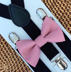 Wow everyone in the room with this dusty rose bow tie and black suspender set! This set is a great choice for family photos, weddings, ring bearer outfit, birthday celebration or any other special occasion. ❤**Please Specify** Bow Tie Only (w/ Clip or Neck Strap), Suspenders Only, or Bow Tie Only & Susp (Bow Tie and Suspenders)SUSPENDERS- One Pair of our Quality SuspendersBOW TIE - One Bow Tie on White Adjustable STRAP or Alligator CLIP*Sizing: Please Check Measurements Before Ordering*Note: If Dusty Rose Bow Tie, Weddings Ring, Groomsmen Suspenders, Brown Suspenders, Tie And Suspenders, Suspenders Wedding, Gentlemen Wear, Outfit Birthday, Black Suspenders