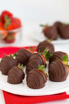 chocolate covered strawberries on a white plate