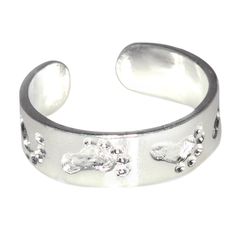 a silver ring with paw prints on it