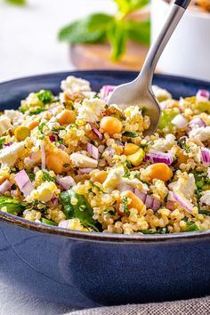 Jennifer Aniston Quinoa Salad in a serving blue bowl with a fork inside Jennifer Aniston Salad, Aniston Salad, Salad With Quinoa, Light Lunch, Quinoa Salad, Vegetarian Cheese