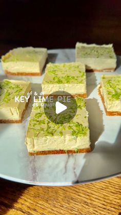 several pieces of cake sitting on a plate with the words key lime cheesecake in front of them