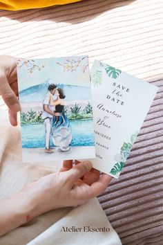 two people holding up wedding cards with watercolors on them and the words save the date written in spanish