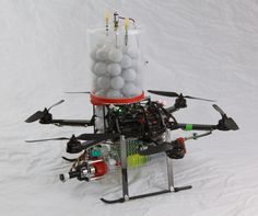 a small helicopter with some balls in it