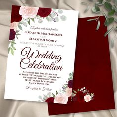 wedding card with flowers and leaves on it