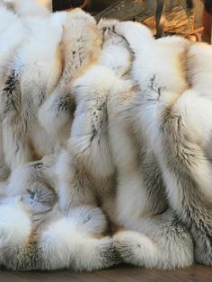 many different furs are piled together on top of each other in the same pattern