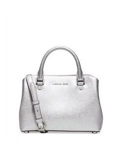 A modern and stunning example of workwear-chic, MICHAEL Michael Kors' structured satchel flaunts a subtly curved shape in saffiano leather. Exceptionally well organized, you'll find a selection of intuitive pockets as well as a sturdy zip compartment and convenient key holder inside.Small sized bag; 10-1/2"W x 7"H x 4"DInterior features lining, center zip compartment, 2 open compartments, 1 open pocket, 1 zip pocket and key chain3"L double handles; 21"-24"L adjustable strapMagnetic snap closureG Michael Kors Selma Medium, Structured Handbags, Michael Kors Selma, Michael Kors Shoulder Bag, Woman Bags Handbags, Satchel Handbags, Purses Michael Kors, Handbags Michael Kors, Leather Satchel