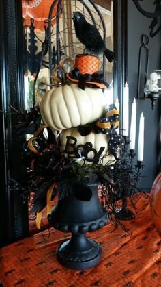 a table topped with lots of halloween decorations