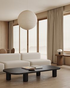 a modern living room with white furniture and large windows looking out onto the mountains in the distance