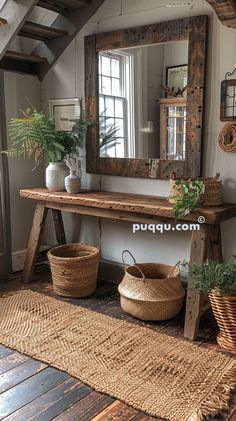 a wooden table sitting under a mirror next to baskets and potted plants on top of a rug