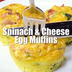 spinach and cheese egg muffins on a white plate with a spatula