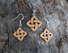 "This beautiful and unique hand-carved Celtic knot wooden jewelry set will be made for you, or a loved one, in my studio on the West of Ireland. These lovely chestnut Celtic love knot necklace and earrings are recycled from musical instruments constructed by a local luthier. As a musician myself, I take enormous satisfaction in creating a jewelry set whose inherent wood has previously featured in a beautiful hand-made harp. Celtic knots date back to the 3rd to 4th century B.C. They were used to Artisan Wooden Jewelry As A Gift, Artisan Wood Jewelry Gift, Rustic Wooden Beads Jewelry As A Gift, Rustic Jewelry With Wooden Beads For Gifts, Traditional Handmade Natural Wood Jewelry, Natural Colored Jewelry Set With Matching Earrings For Gifts, Rustic Natural Wood Jewelry, Rustic Carved Jewelry As Gift, Rustic Wooden Jewelry For Gifts