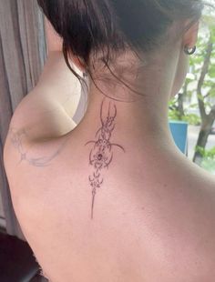 a woman with a tattoo on her back